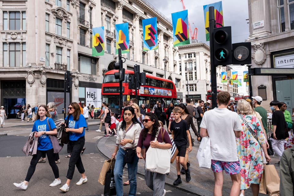 <p>Shoppers on Oxford Street</p>